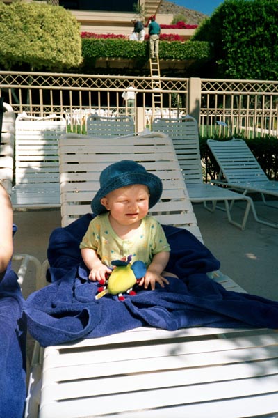 Emma in the lounge chair by the pool