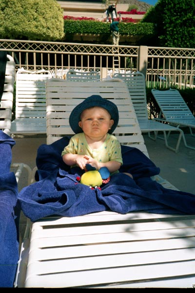 Emma relaxing by the pool - sign of things to come !