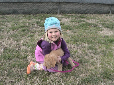 Emma taking Crumpet on her first real walk outdoors, at Freedom Park in Charlotte 2007