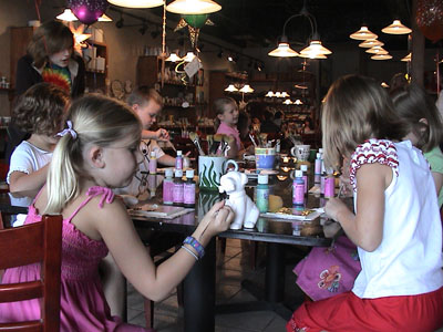 Painting pottery seems a hit with the kids