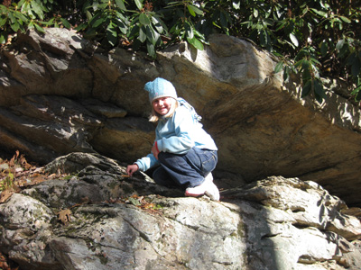 Emma climbing on rocks