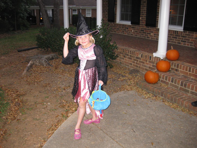 Emma leaving house to meet her friends and begin Trick or Treat