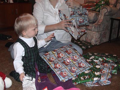 Emma unwrapping gifts