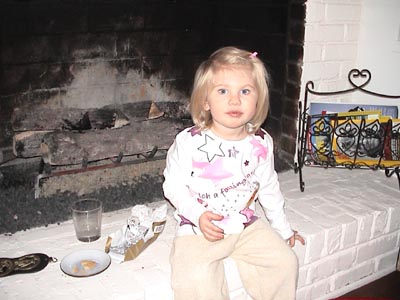 Christmas Day morning and Emma sees that Santa has eaten the biscuits and drank the milk we left for him but left some chocolate - ooooo boy