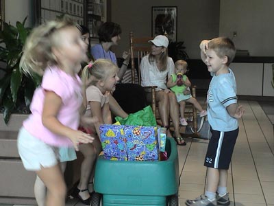 Emma loading some of her toys into the trolley