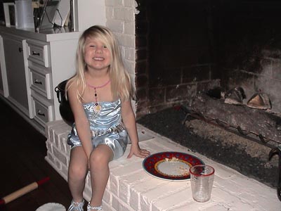 Emma notices that the milk and chocolate biscuit has been eaten by Santa