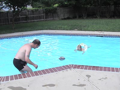 Mark and Emma playing in the pool