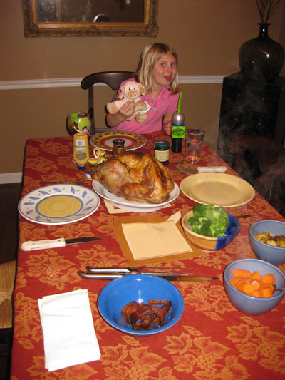 Emma at the dinner table awaiting the turkey