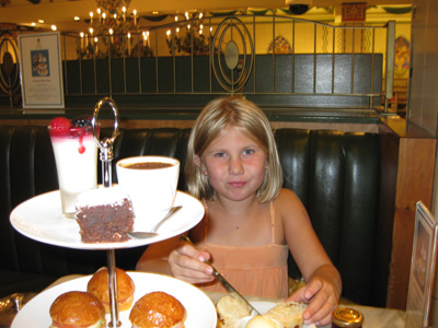 Emma indulging in Jam, Clotted Cream and Scones at Harrods