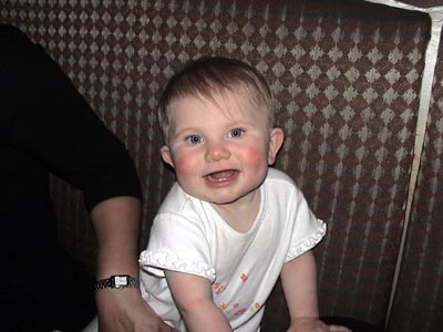 Emma smiling seated in the couch at the Sushi Restaurant