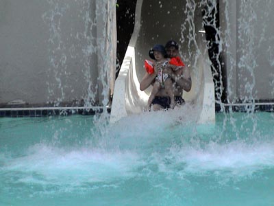 Stewart and Emma on the water slide at the hotel pool