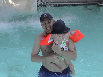 Stewart and Emma come down the water slide