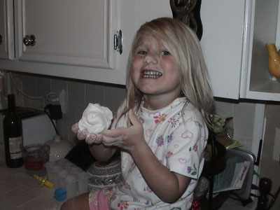 Emma with flour while cooking India food