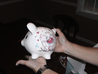 Emma and her first piggy bank