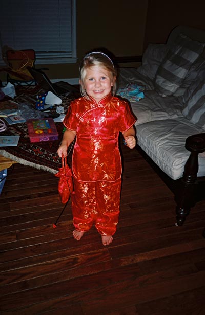 Emma is four, we buy her a red chinese outfit which she loves