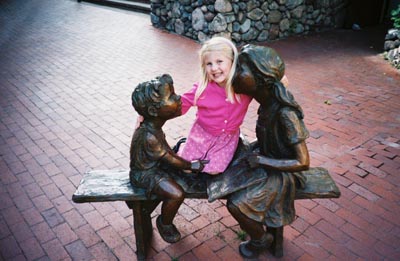 Emma shopping in Vail and a statue to some children