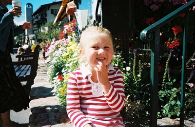 Emma by some flowers at a German Restaurant downtown Vail