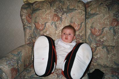 Emma try's Dad's new slippers !